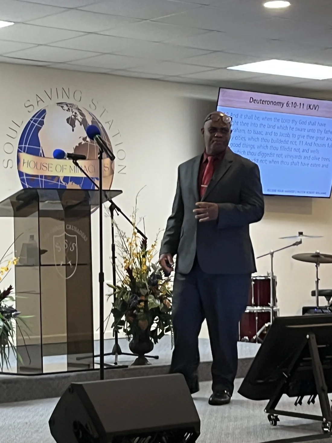 A speaker sharing the Word in the House of Miracles sanctuary